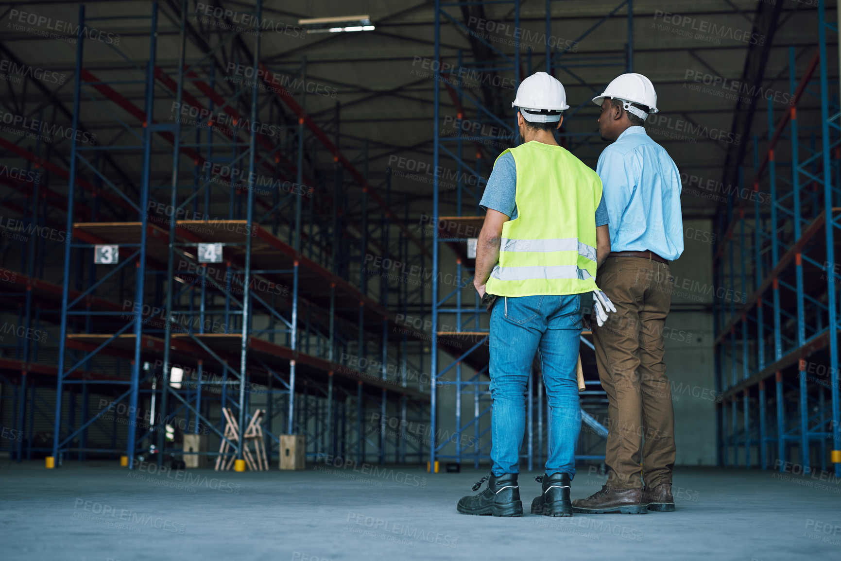 Buy stock photo Shot of two builders inspecting a construction site