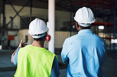 Buy stock photo Shot of two builders inspecting a construction site