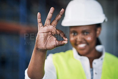 Buy stock photo Black woman, architect and hands with okay sign for construction success, good job or precise on site. Hand of happy African female person engineer showing OK emoji, yes or perfect in architecture