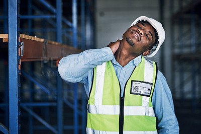 Buy stock photo Shot of a young man experiencing neck pain while working at a construction site