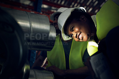 Buy stock photo Shot of a young man and woman doing inspections at a construction site