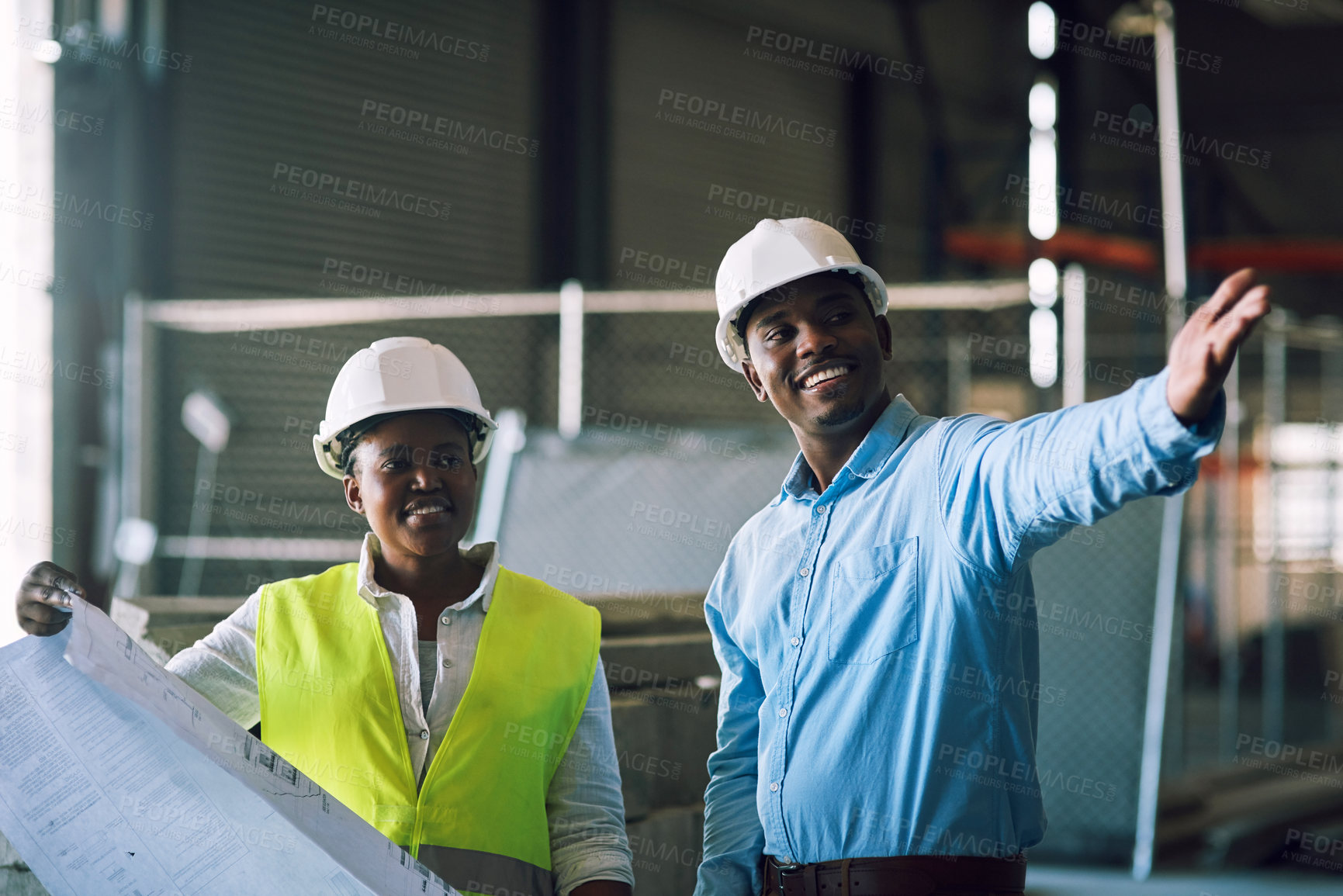 Buy stock photo Shot of two builders having a meeting at a construction site