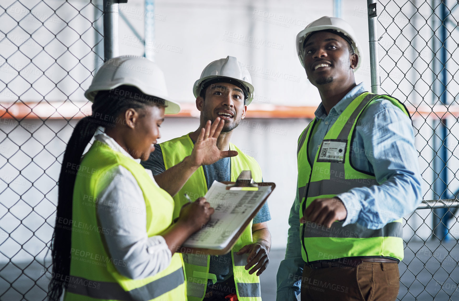 Buy stock photo Shot of a group of builders inspecting a construction site