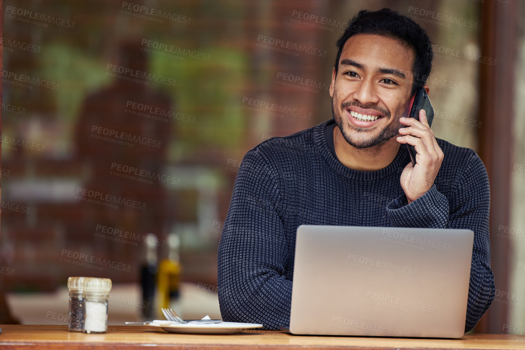 Buy stock photo Man, phone call and laptop in coffee shop for remote work with smile, contact or negotiation with media agency. Writer, computer and smartphone for story, chat or freelance copywriting in cafeteria