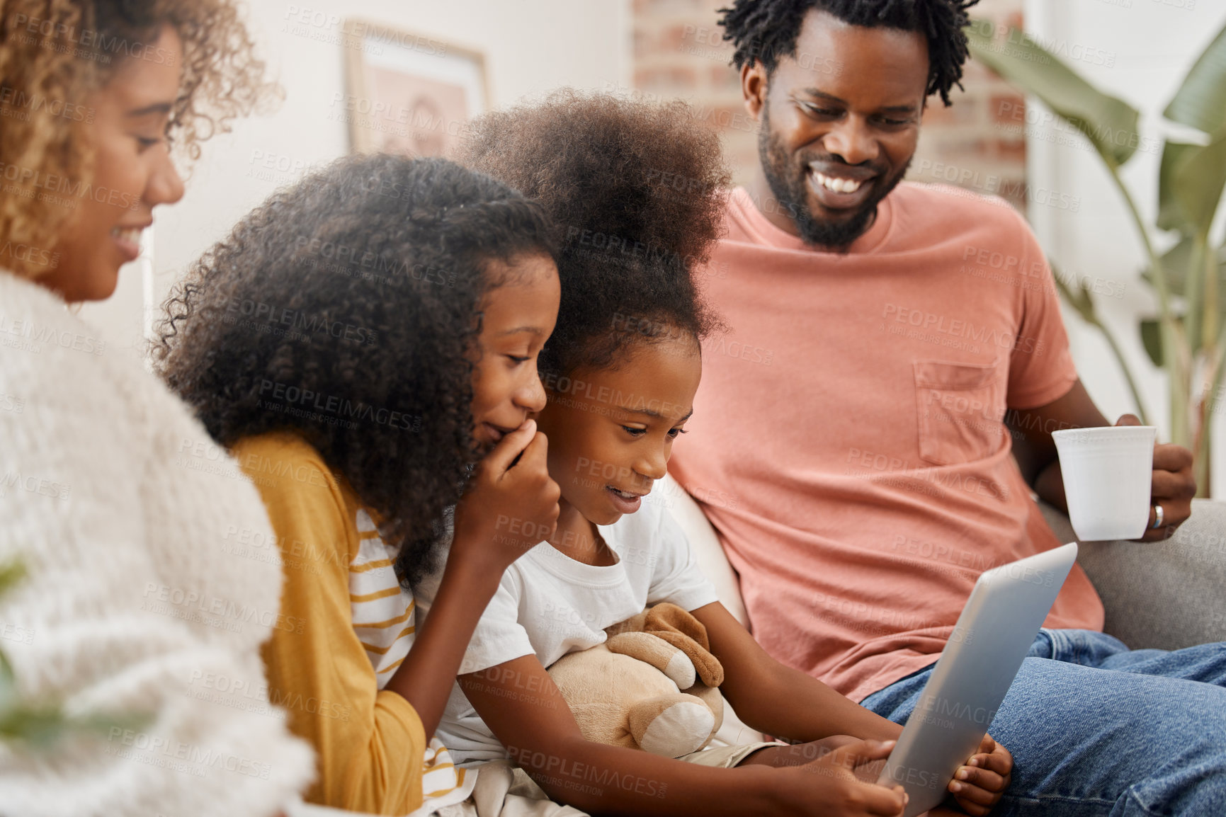 Buy stock photo Black family, kids and tablet for education, learning or gaming on sofa of home living room together. Coffee, tech and happy parents with girl children in apartment for research, streaming or study