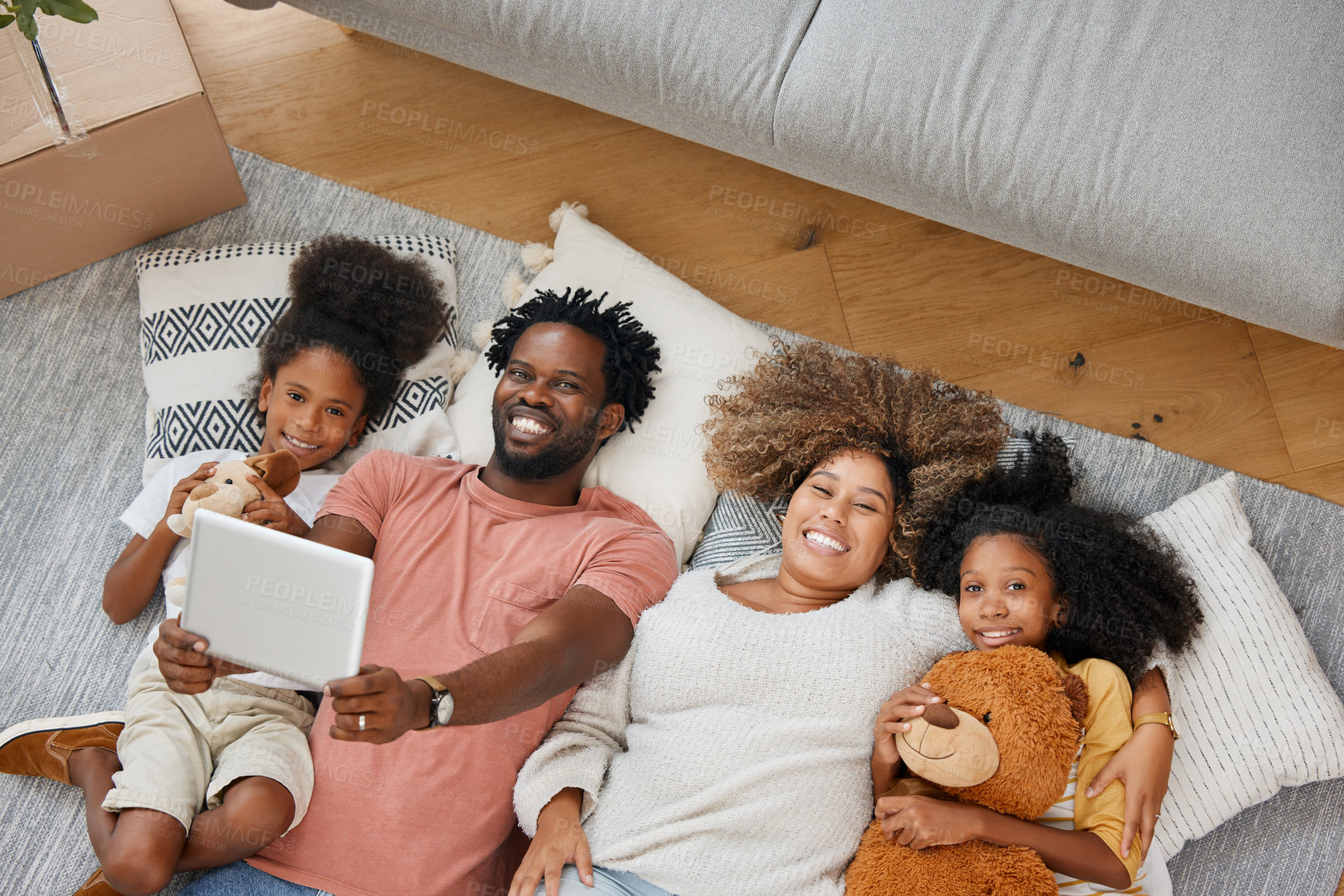 Buy stock photo Family, portrait and tablet playing games on living room floor in home for entertainment, bonding and fun. Happy, parents and children with tech in house for learning, development or streaming videos