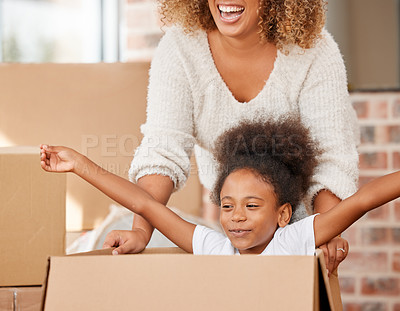 Buy stock photo Mom, girl and happy on playing with box in home for moving, packing and excited with property. Black people, new house and ownership with bonding on cardboard for games, playful and enjoy with fun