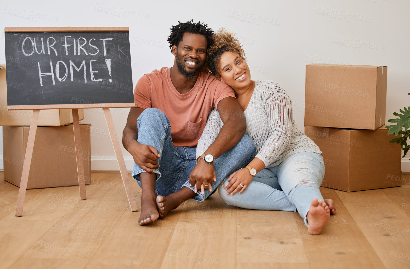 Buy stock photo Portrait of a young couple sitting on the floor while moving house