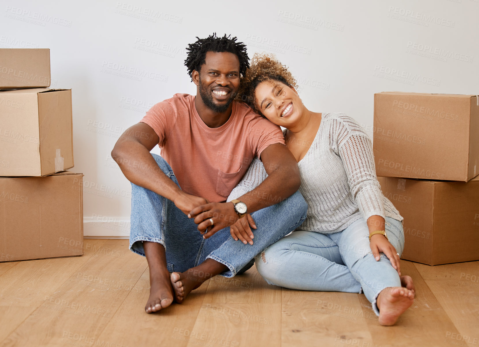 Buy stock photo Portrait of a young couple sitting on the floor while moving house