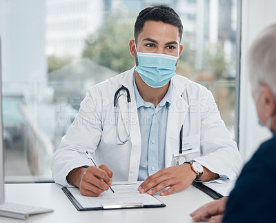 Buy stock photo Doctor, man and tablet with mask in office for healthcare, information and consulting in clinic with patient. Professional male person, medical advice and technology in hospital for elderly care