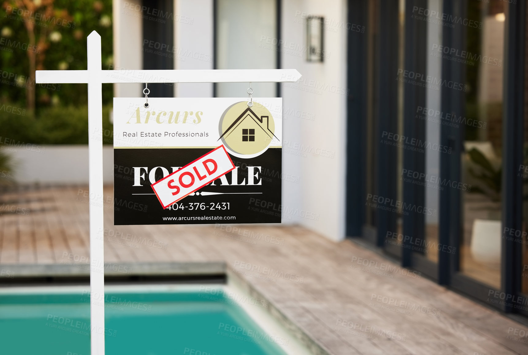 Buy stock photo Cropped shot of a sold sticker on a for sale sign sitting outside of a home during the day