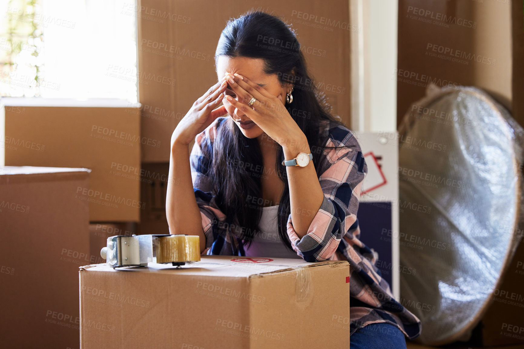 Buy stock photo Stress, woman and moving house with headache, boxes and anxiety, tired and packing, bankrupt and debt crisis. Frustrated, female person and apartment , burnout and problem, property or mortgage loan