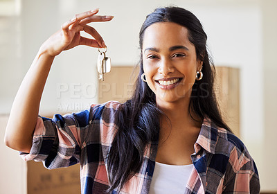 Buy stock photo Shot of a young woman showing the keys to her new home