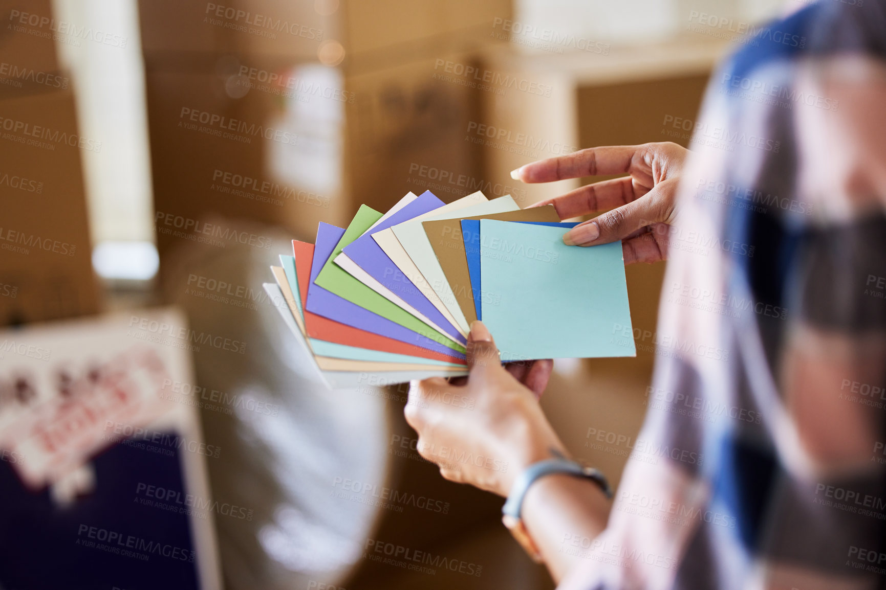 Buy stock photo Shot of a unrecognizable woman deciding which colour to use at home