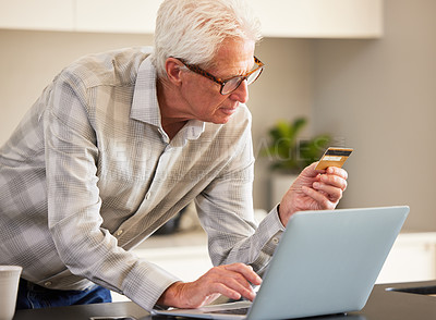 Buy stock photo Shot of a mature man using a laptop