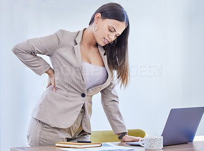 Buy stock photo Woman, business and back pain in office with laptop for career, accounting with notebook for stats. Female accountant, workplace and computer with injury at desk for health, consultant for financial