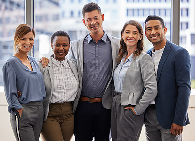 Buy stock photo Shot of a diverse group of businesspeople standing close together in the office