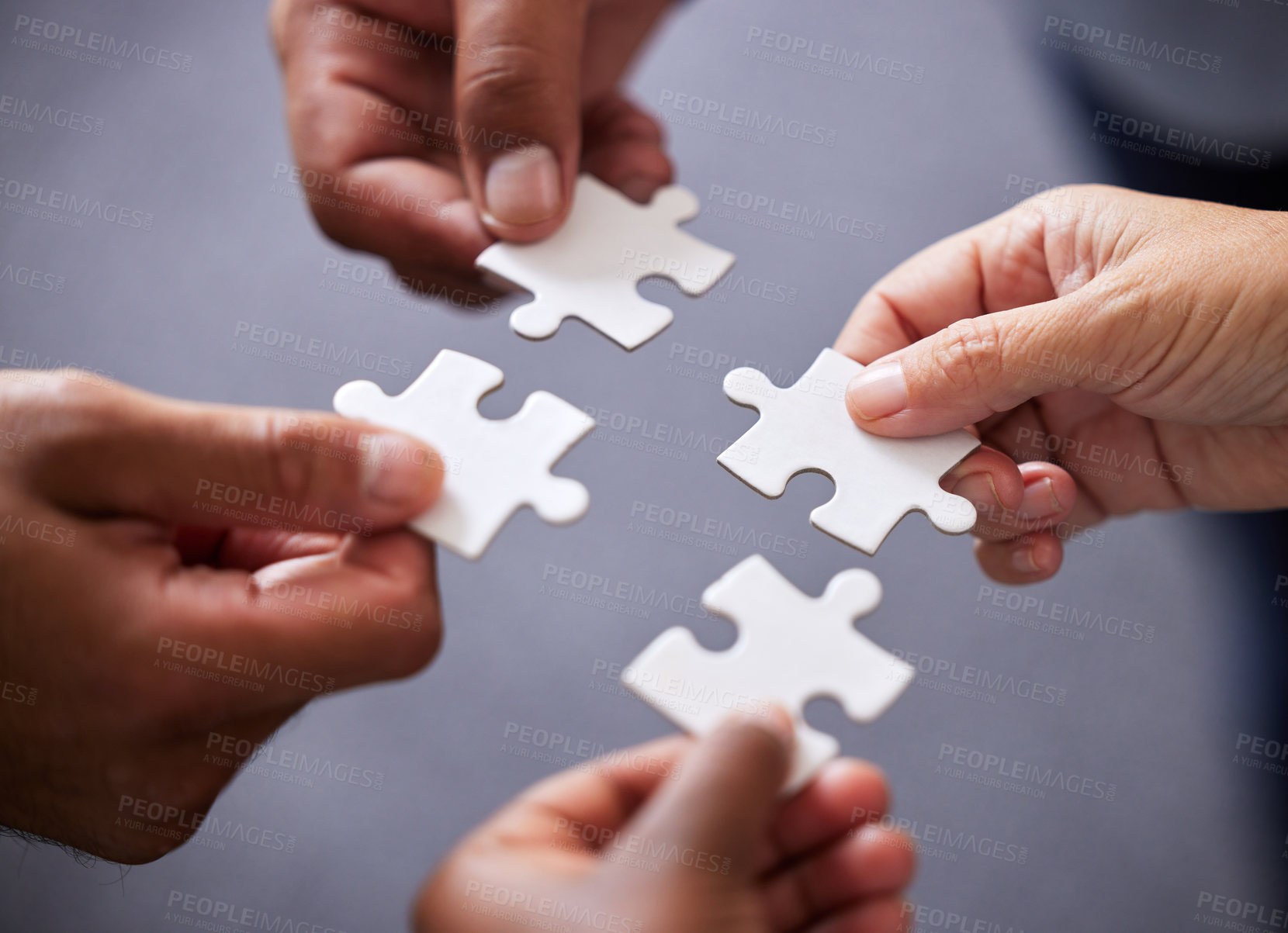 Buy stock photo Hands, collaboration and business people with puzzle in office for teamwork or synergy with joint effort. Corporate, group and partnership with unity in company or trust with employees in Sweden.