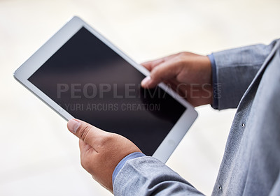 Buy stock photo Cropped shot of an unrecognizable man using a digital tablet