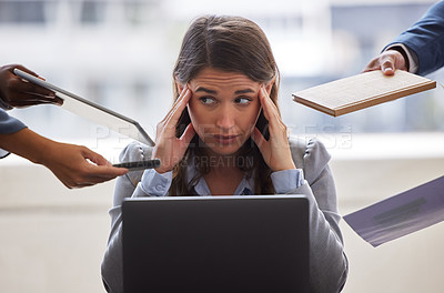 Buy stock photo Shot of a businesswoman looking overwhelmed in a demanding office environment