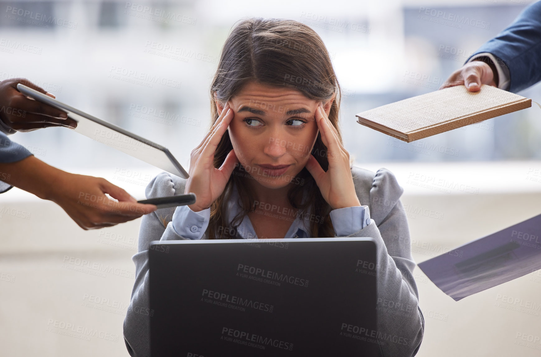 Buy stock photo Shot of a businesswoman looking overwhelmed in a demanding office environment