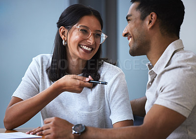 Buy stock photo Happy, young couple and documents with pen for signature, financial investment or insurance for future. Exited, woman and man with smile, discussion and paperwork to sign for house, contract or loan