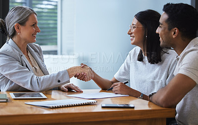 Buy stock photo Happy, couple and handshake with financial advisor for deal, agreement or contract. Smile, man and woman shaking hands of broker for finance, loan or mortgage, welcome and thank you for investment.