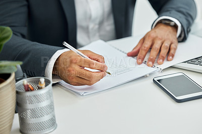 Buy stock photo Shot of unrecognizable businessman doing paperwork at desk