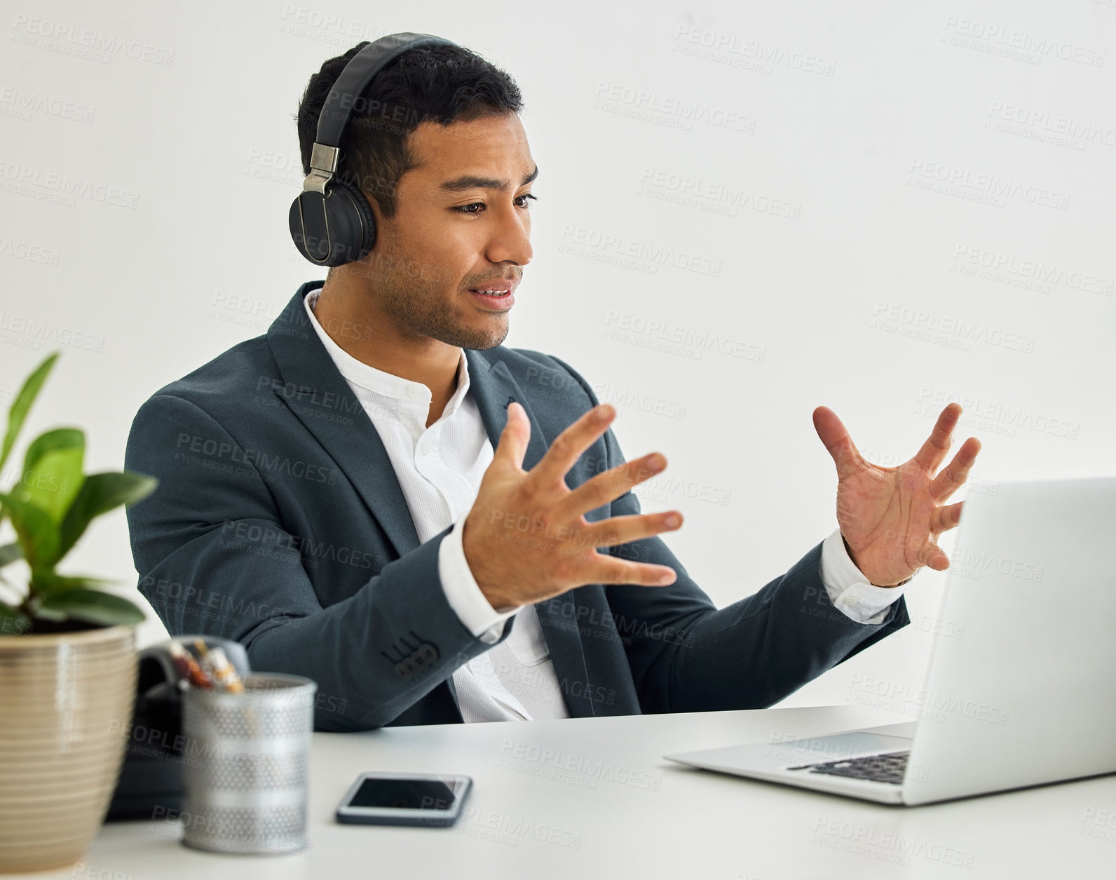 Buy stock photo Shot of a businessman on a video call in a modern office