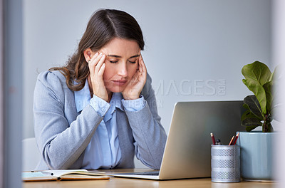 Buy stock photo Shot of a businesswoman experiencing a headache at work
