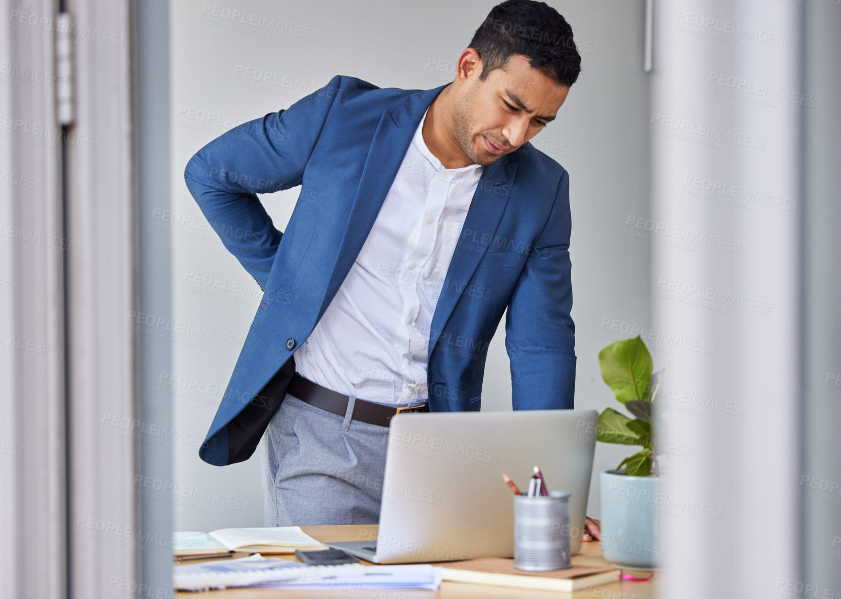 Buy stock photo Injured, businessman and laptop in office with back pain for stress, emergency or accidental sprain. Male person, frustration and spine problems in workplace for burnout, overwork and crisis