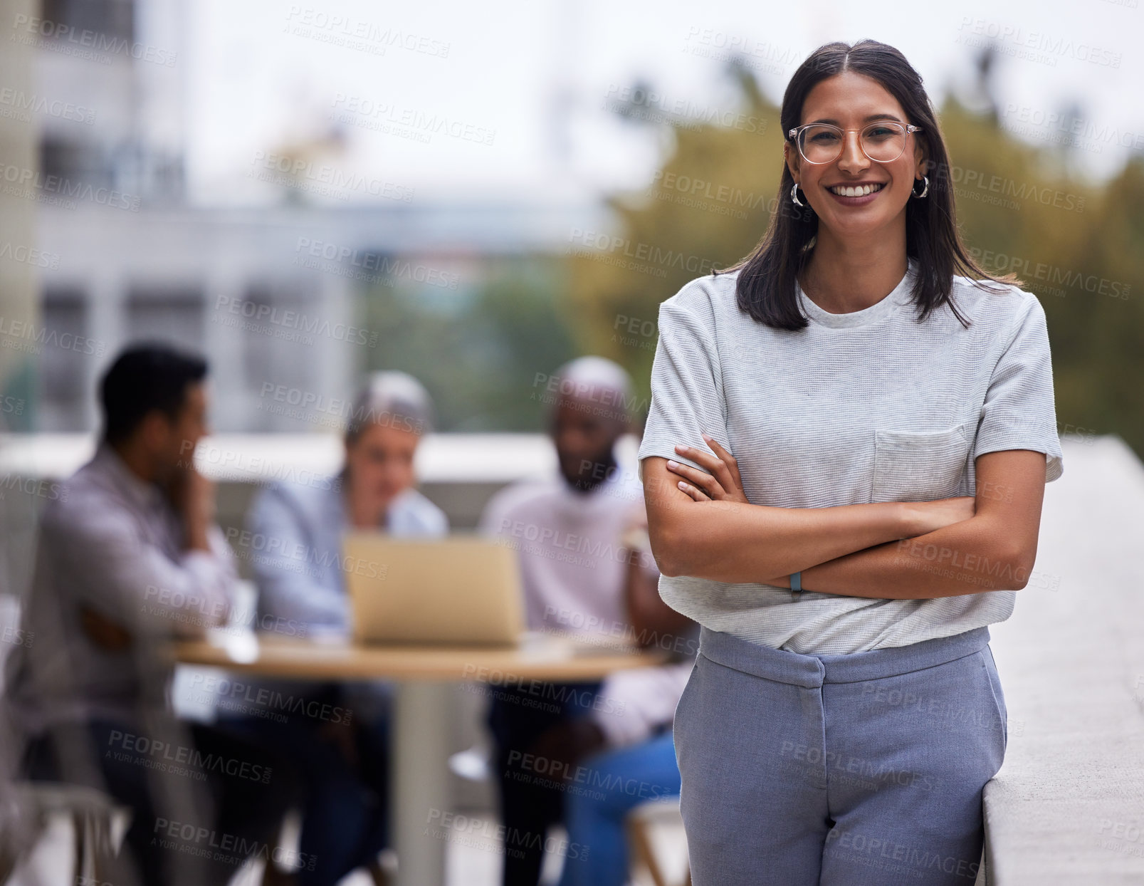 Buy stock photo Portrait, crossed arms and woman with business people on balcony for collaboration, leadership or confidence. Smile, meeting and female designer with pride by team in discussion on office rooftop.