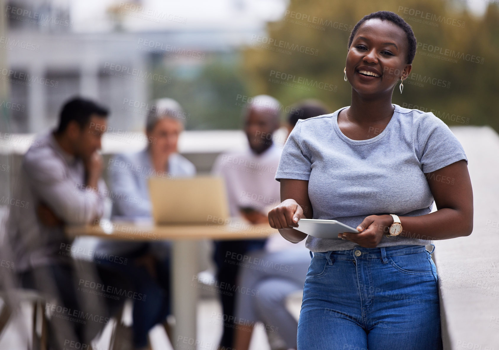 Buy stock photo Shot of a young businesswoman standing outside the office