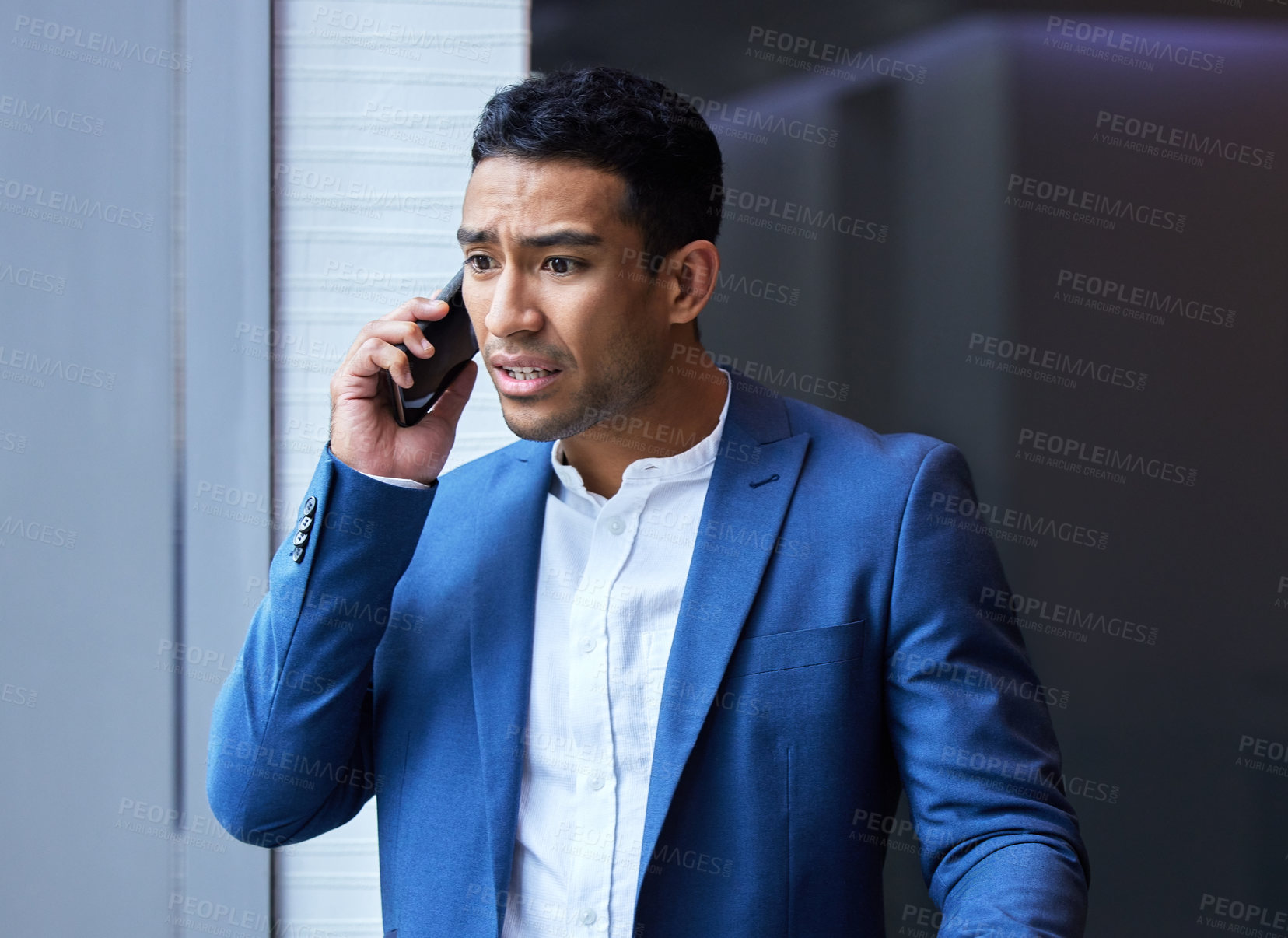 Buy stock photo Phone call, stress and businessman by window for communication, anxiety and frustrated in office. Male manager, smartphone and upset in conversation for disappointed, inconvenience and company