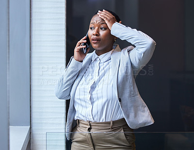 Buy stock photo Shot of a young woman using her phone at work