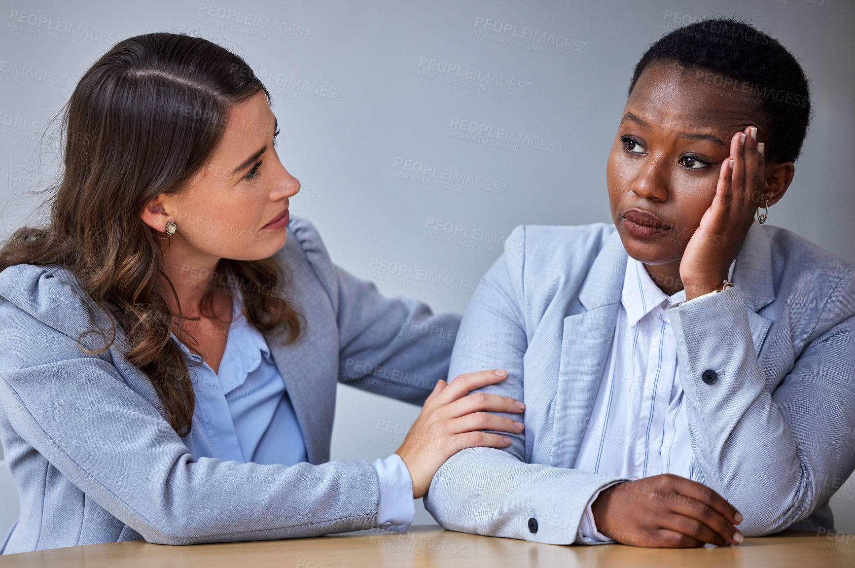 Buy stock photo Sad, business woman and hr for therapy, help and emotional support with counselling in office. Stress, female person and manger with hug for care, communication and depression with corporate empathy