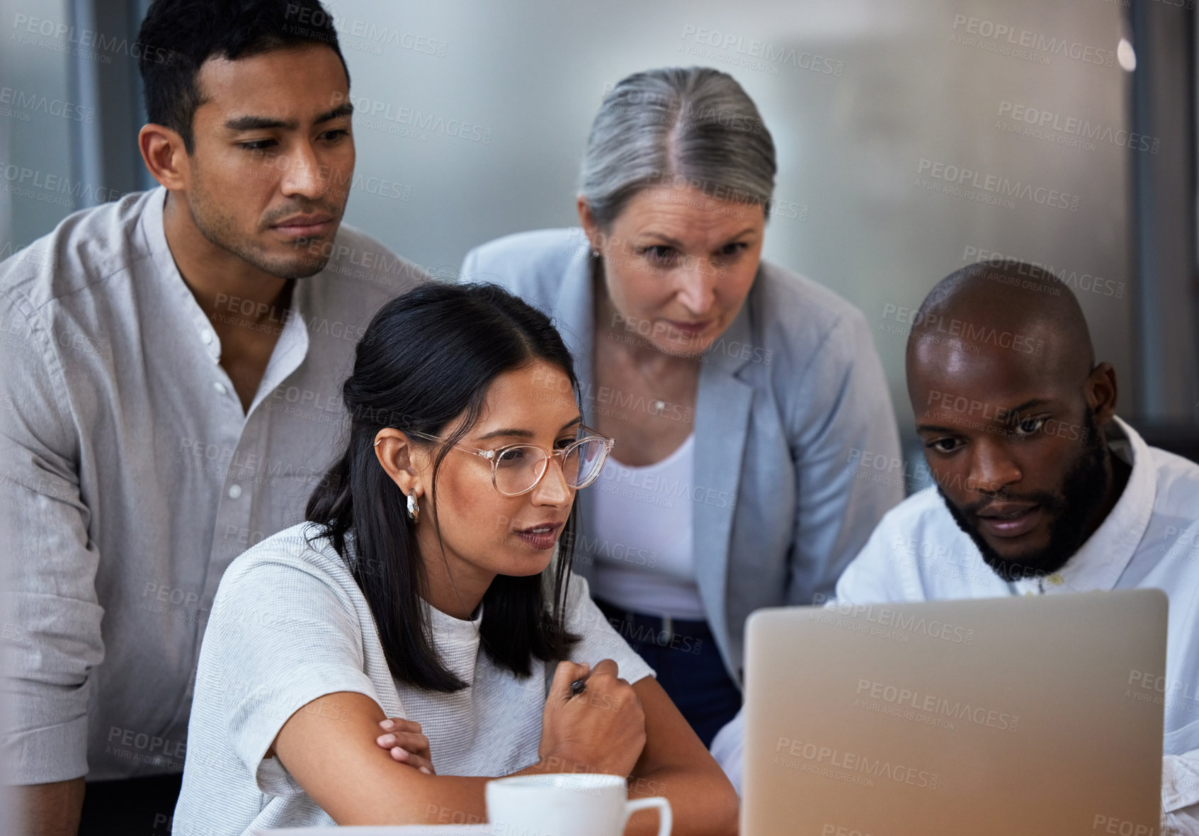 Buy stock photo Shot of diverse group of businesspeople having a quick meeting in an office