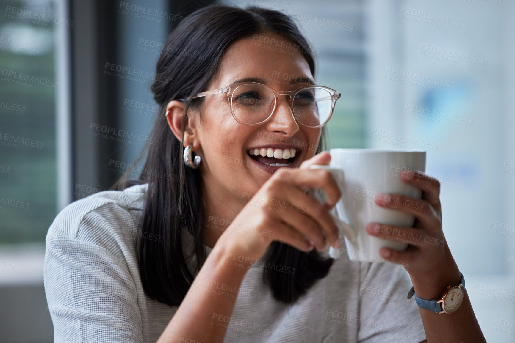 Buy stock photo Shot of a young woman having coffee in a modern office