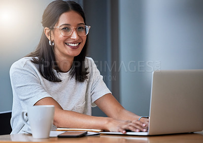 Buy stock photo Shot of a young woman having coffee and working in a modern office