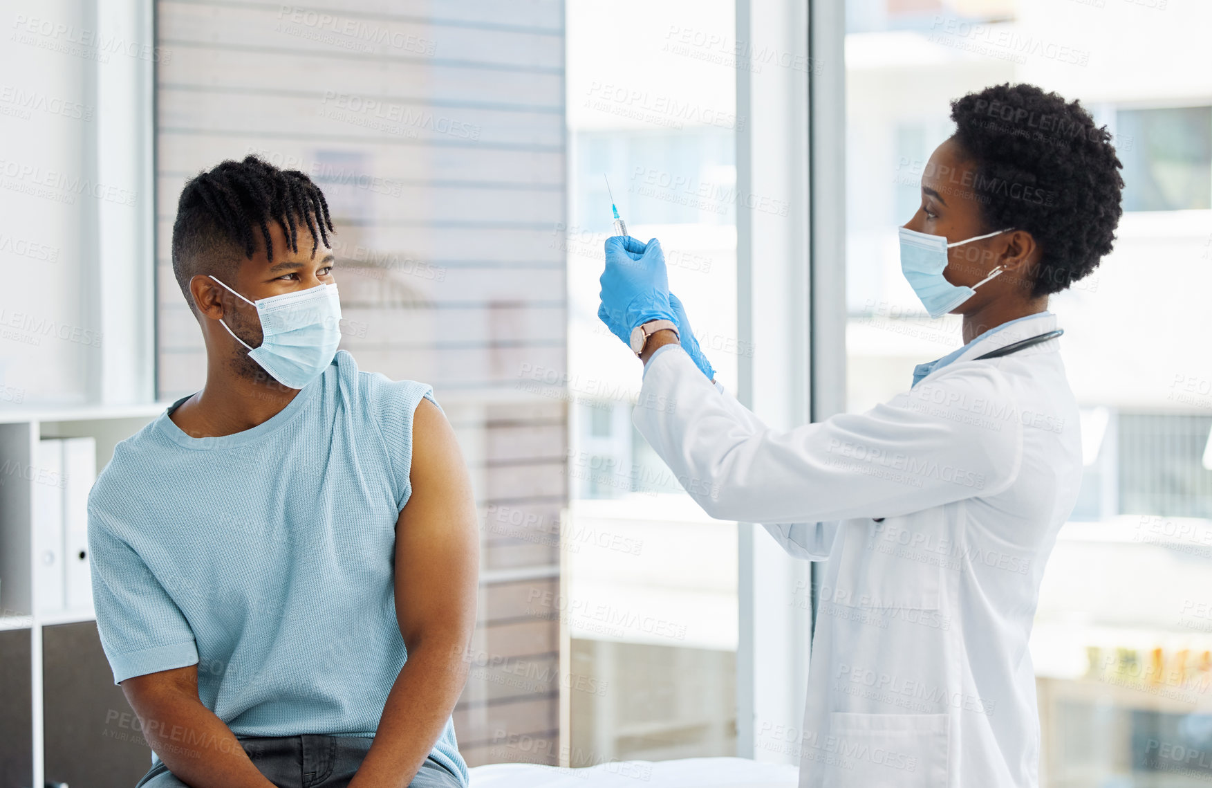 Buy stock photo Doctor, patient and injection at hospital with safety gear for virus, medicine for wellness. Female nurse, man and healthcare in clinic with syringe for flu vaccine, test or check for air bubbles