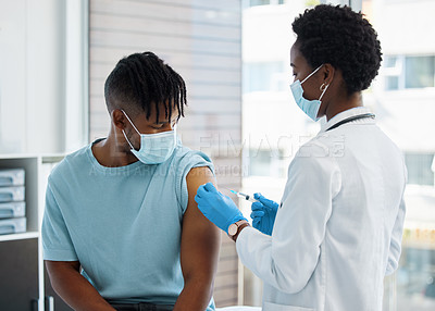 Buy stock photo Shot of a doctor giving her patient an injection