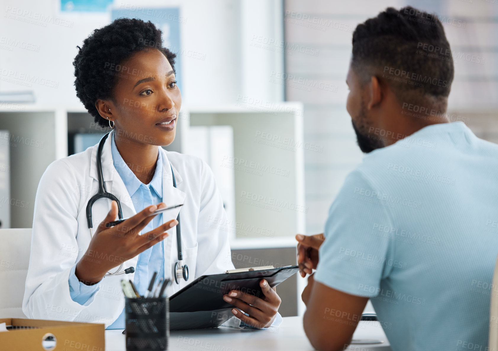 Buy stock photo Shot of a doctor having a consultation with a patient