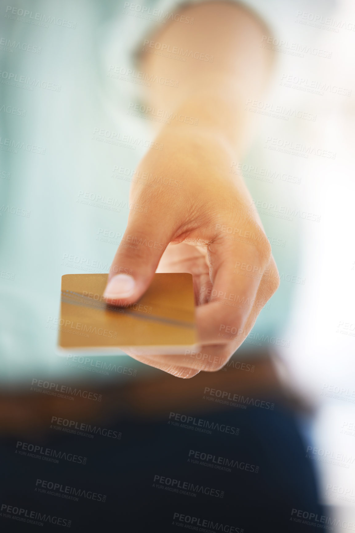 Buy stock photo Shot of an unrecognizable person holding a credit card