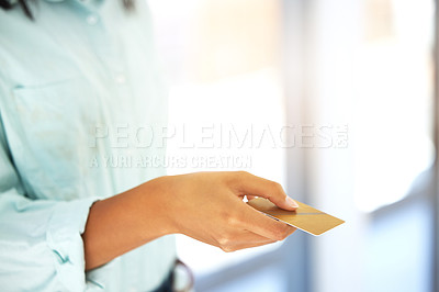 Buy stock photo Shot of an unrecognizable person holding a credit card