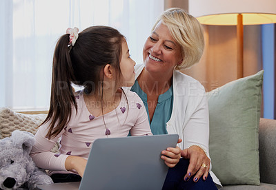 Buy stock photo Child, grandma and laptop in home for e learning, reading and streaming video with mobile app. Girl, senior woman and happy on weekend with technology, internet and family for games or movie on couch