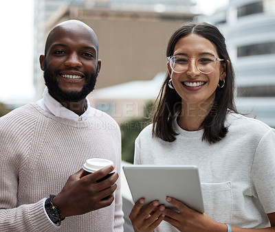 Buy stock photo Portrait of two businesspeople drinking coffee and using a digital tablet outside an office