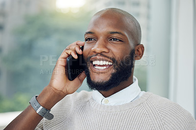 Buy stock photo Cropped shot of a handsome young businessman making a phonecall while standing on the balcony of his office