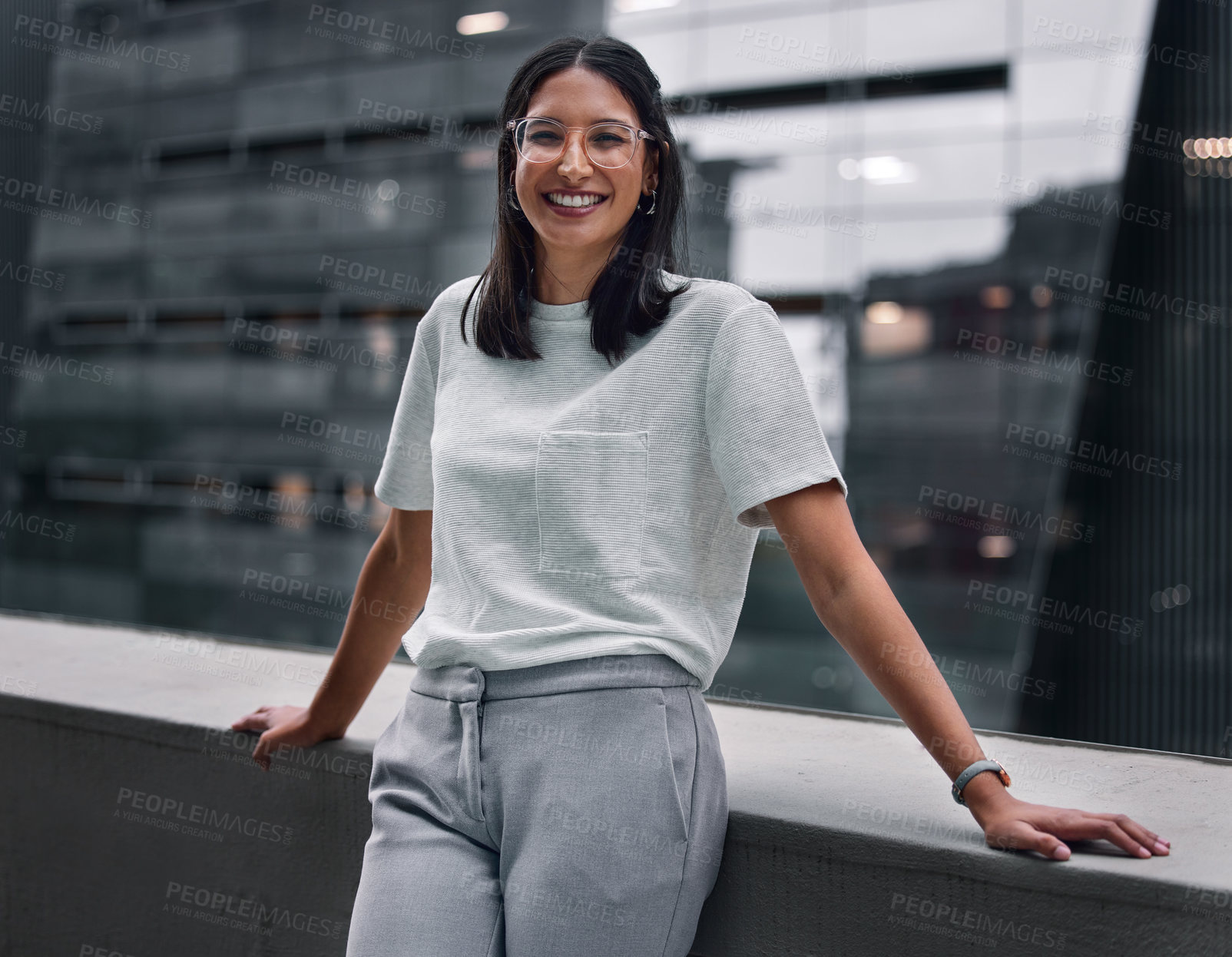 Buy stock photo Balcony, portrait and smile of designer woman at office outdoor in city to relax for break. Design, glasses and business with happy employee in urban town for creative career as editor or publisher
