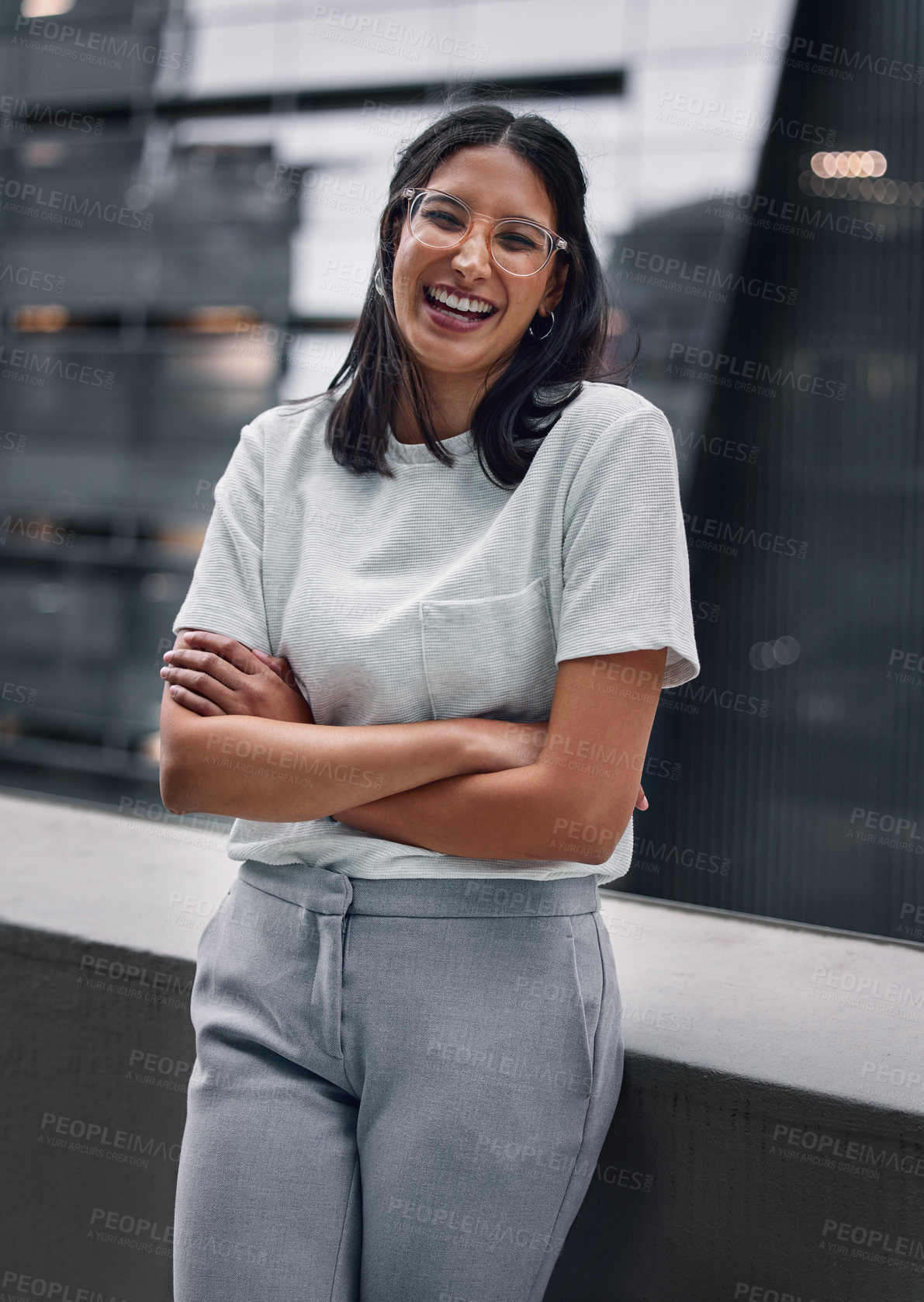 Buy stock photo Arms crossed, balcony and portrait of designer woman at office outdoor in city to relax for break. Design, glasses and smile with happy employee laughing in urban town for creative career as editor