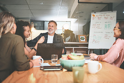 Buy stock photo Shot of a diverse group of businesspeople sitting together in the office and having a meeting